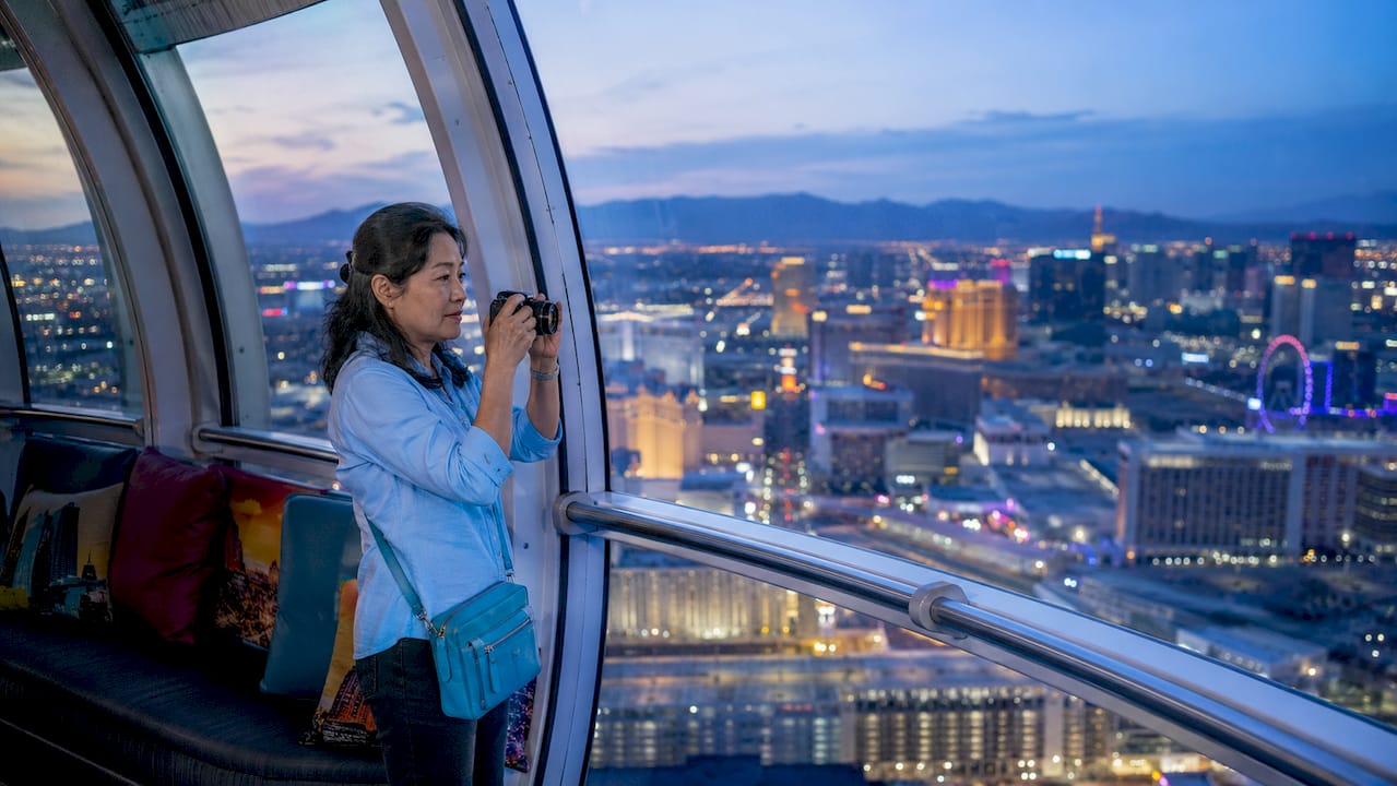 Woman photographing Las Vegas Strip from High Roller pod