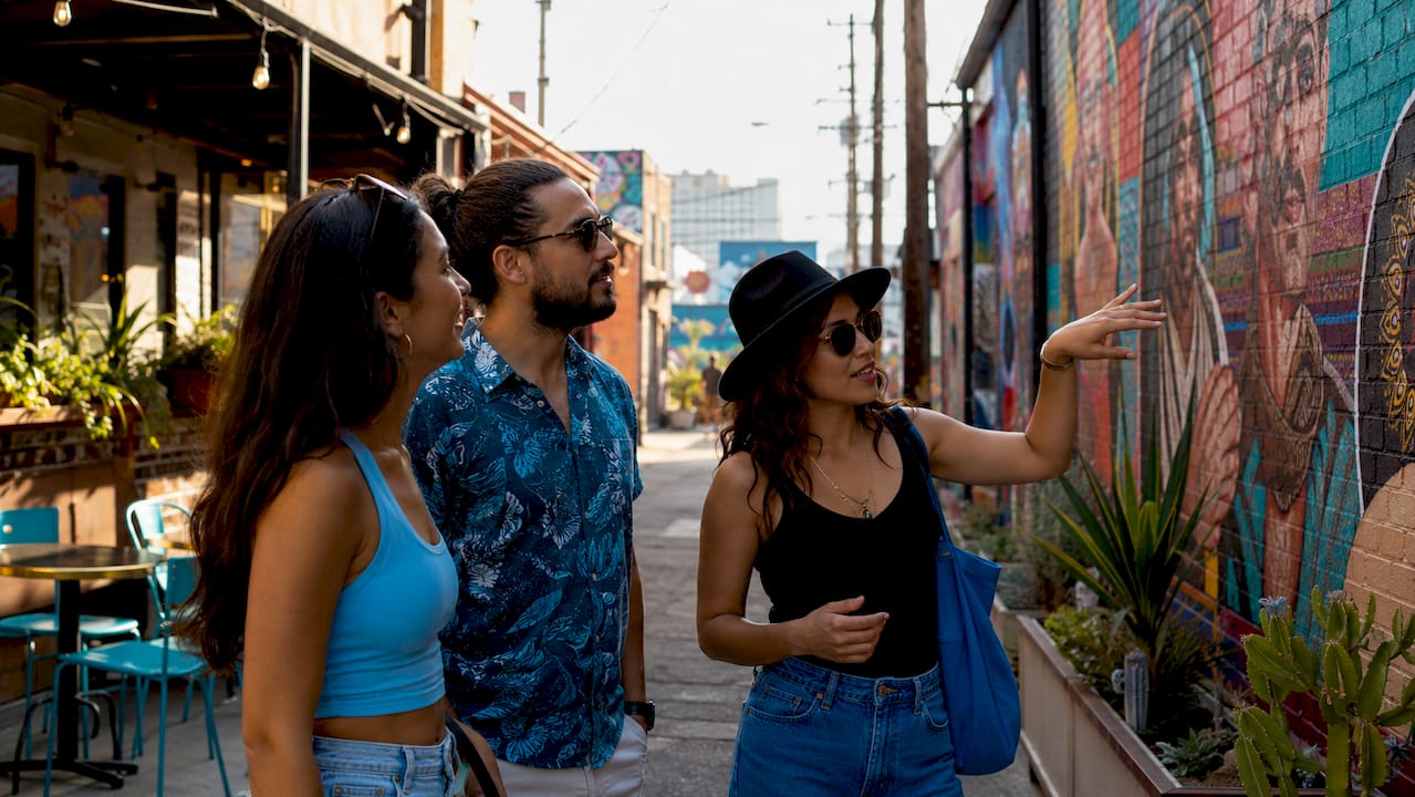 Friends admiring murals in Las Vegas Arts District